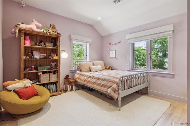 435 Ivanhoe St, Denver, CO 80220 - bedroom with vaulted ceiling and wood finished floors