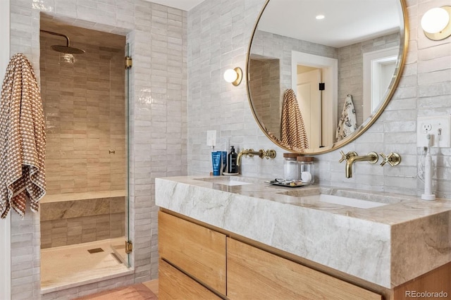 435 Ivanhoe St, Denver, CO 80220 - full bathroom with a shower stall, double vanity, backsplash, and tile walls