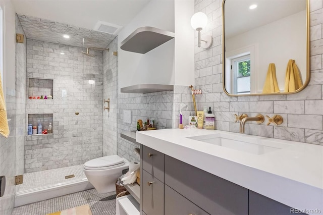 435 Ivanhoe St, Denver, CO 80220 - bathroom with vanity, tile walls, a stall shower, tile patterned flooring, and backsplash