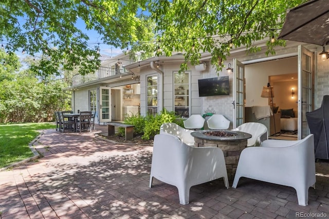 435 Ivanhoe St, Denver, CO 80220 - view of patio featuring a fire pit and outdoor dining space