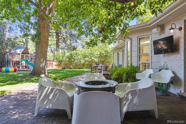 435 Ivanhoe St, Denver, CO 80220 - view of patio / terrace featuring an outdoor fire pit and a playground