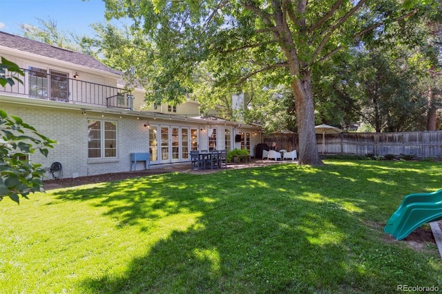435 Ivanhoe St, Denver, CO 80220 - view of yard featuring a playground and a patio area