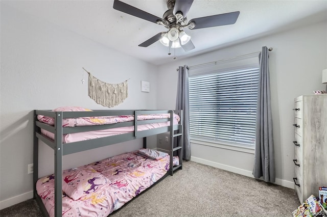 carpeted bedroom featuring a ceiling fan and baseboards