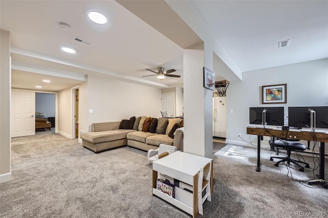 carpeted living room with ceiling fan, visible vents, and baseboards