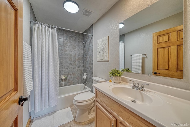 318 Southgate Rd, Florissant, CO 80816 - bathroom with a textured wall, vanity, shower / bath combo with shower curtain, toilet, and tile patterned flooring