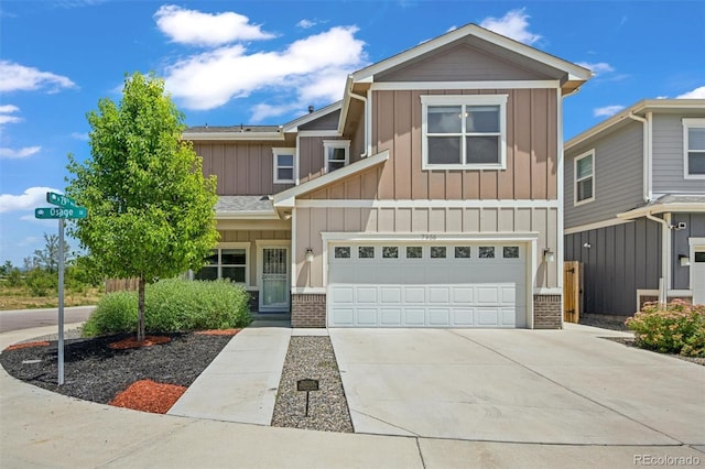 7956 Osage St, Denver, CO 80221 - view of property featuring board and batten siding, concrete driveway, and an attached garage