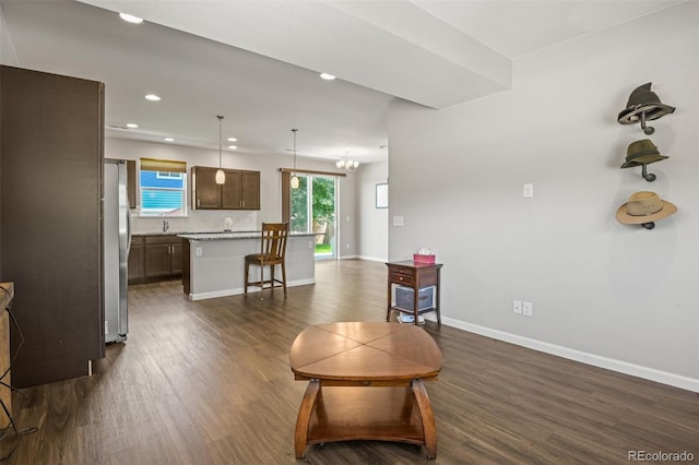 7956 Osage St, Denver, CO 80221 - living area with dark wood-style floors and recessed lighting