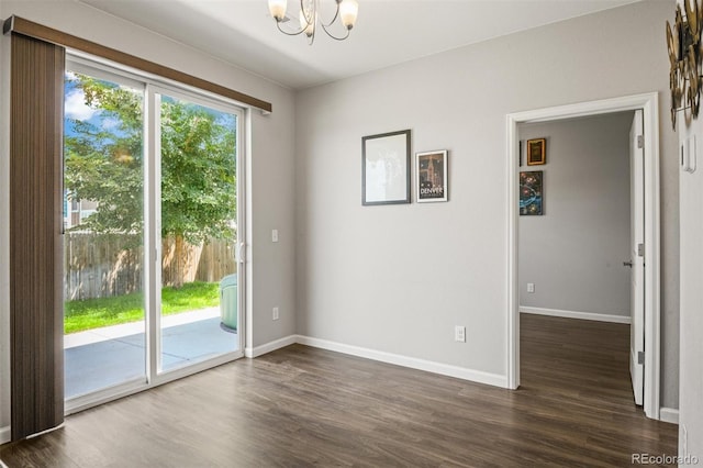7956 Osage St, Denver, CO 80221 - doorway to outside with a chandelier and dark wood-style flooring