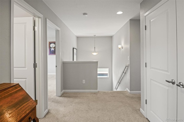 7956 Osage St, Denver, CO 80221 - hallway with an upstairs landing, carpet flooring, and recessed lighting