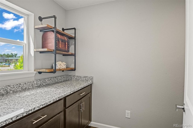 7956 Osage St, Denver, CO 80221 - bathroom with vanity and baseboards