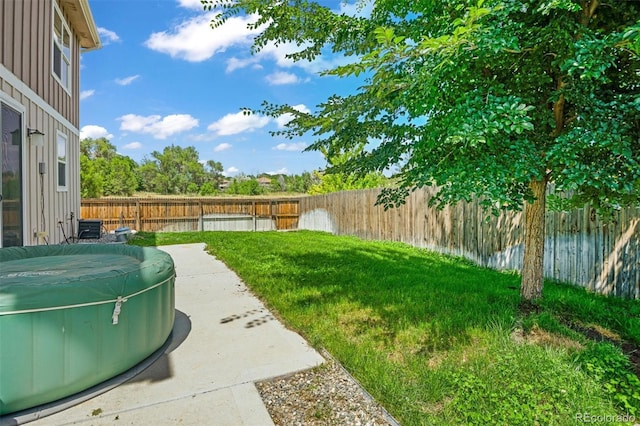 7956 Osage St, Denver, CO 80221 - fenced backyard featuring a hot tub