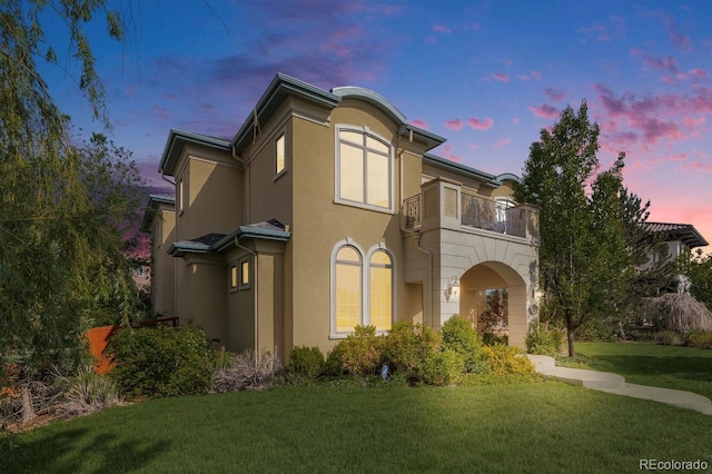 2362 Spruce Way, Denver, CO 80238 - townhome / multi-family property featuring a balcony, a front lawn, and stucco siding