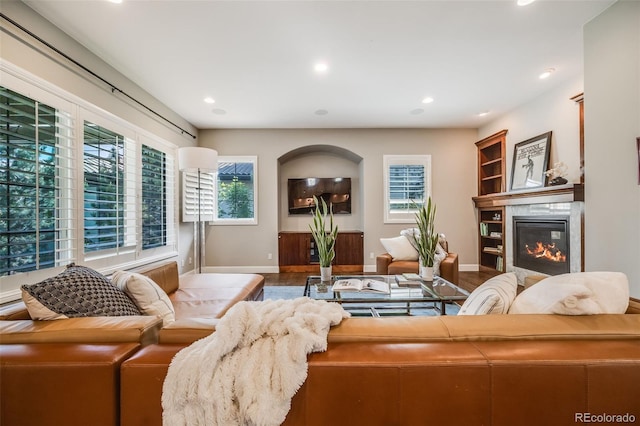 2362 Spruce Way, Denver, CO 80238 - living room with a glass covered fireplace, baseboards, recessed lighting, and wood finished floors