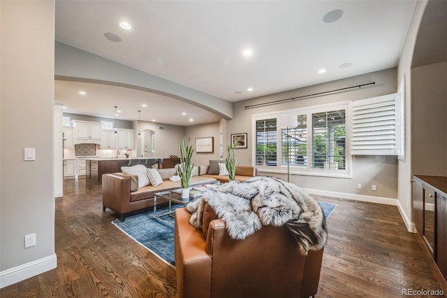 2362 Spruce Way, Denver, CO 80238 - living room with arched walkways, dark wood finished floors, recessed lighting, and baseboards
