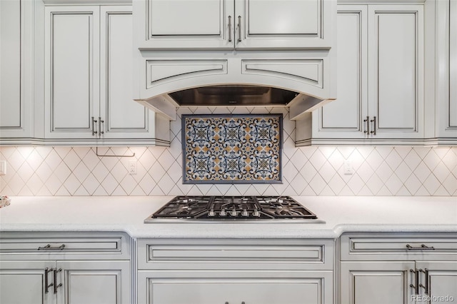 2362 Spruce Way, Denver, CO 80238 - kitchen with stainless steel gas cooktop, tasteful backsplash, and custom range hood