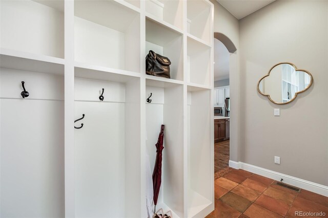 2362 Spruce Way, Denver, CO 80238 - mudroom featuring arched walkways and baseboards