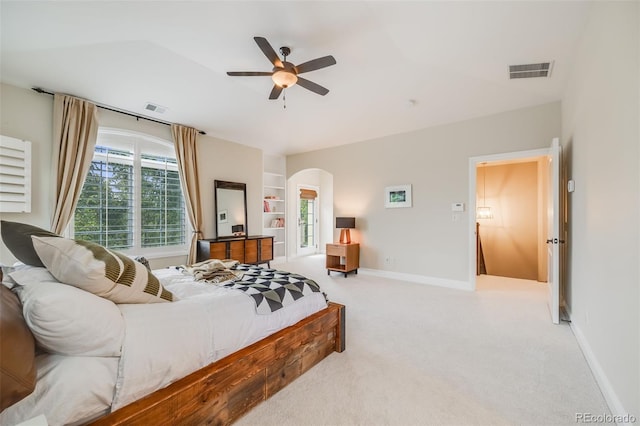 2362 Spruce Way, Denver, CO 80238 - bedroom with light carpet, arched walkways, baseboards, and ceiling fan