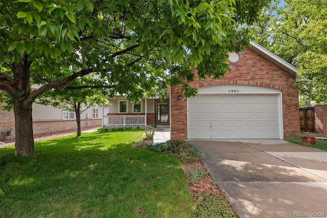 1901 S Union Pl, Lakewood, CO 80228 - view of property hidden behind natural elements featuring brick siding, a front yard, driveway, a garage, and covered porch