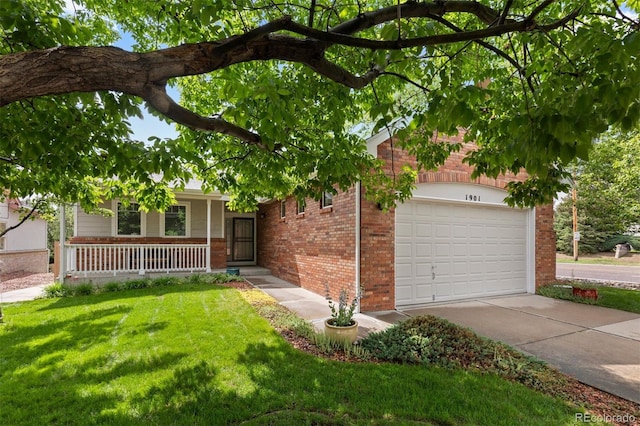 1901 S Union Pl, Lakewood, CO 80228 - ranch-style home featuring brick siding, a front lawn, covered porch, a garage, and driveway