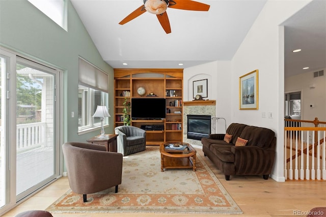 1901 S Union Pl, Lakewood, CO 80228 - living room with wood finished floors, ceiling fan, a glass covered fireplace, vaulted ceiling, and recessed lighting