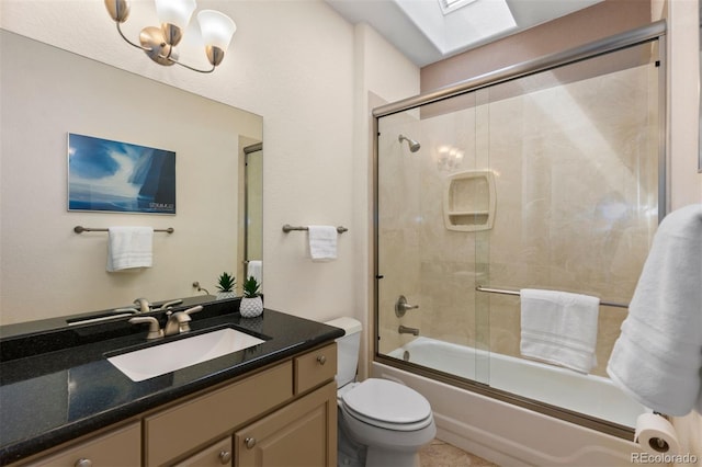 1901 S Union Pl, Lakewood, CO 80228 - full bathroom with vanity, a skylight, bath / shower combo with glass door, and a chandelier