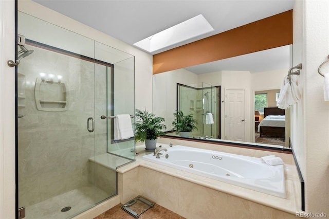 1901 S Union Pl, Lakewood, CO 80228 - full bathroom featuring a skylight, a shower stall, a jetted tub, ensuite bathroom, and tile patterned floors