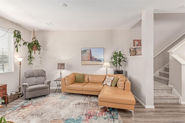 4790 Kittredge St, Denver, CO 80239 - living area featuring wood finished floors and stairway