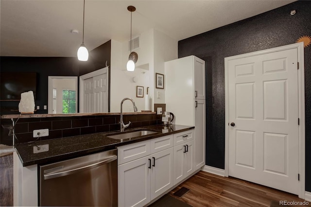 2430 W 82nd Pl Unit 2F, Westminster, CO 80031 - kitchen with dishwasher, a sink, dark wood-type flooring, a peninsula, and white cabinetry