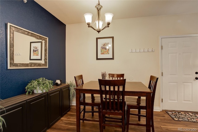 2430 W 82nd Pl Unit 2F, Westminster, CO 80031 - dining area with dark wood-type flooring and a chandelier