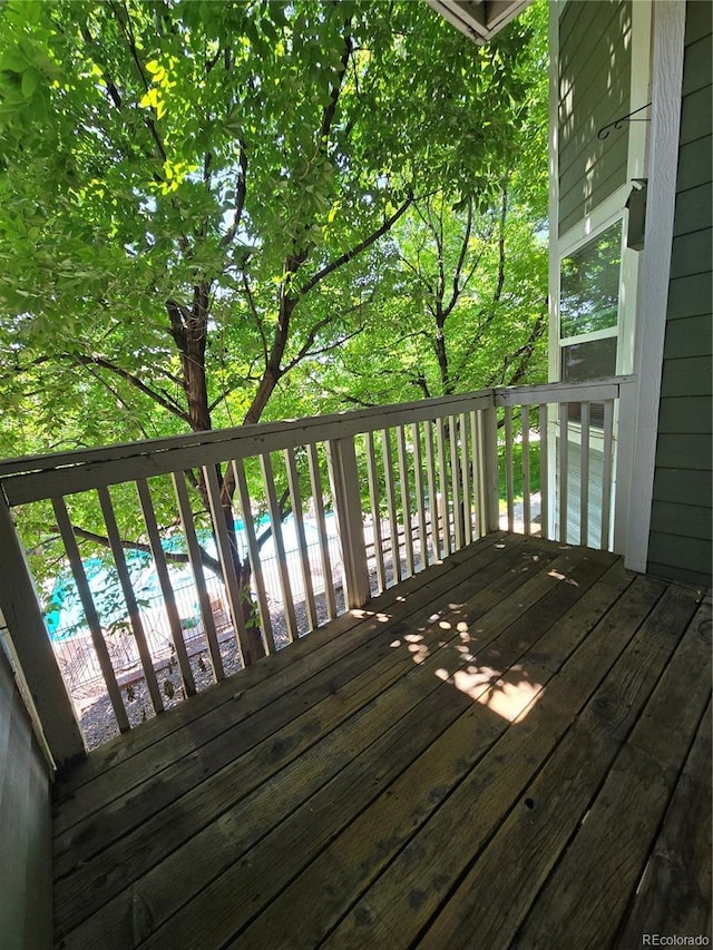 2430 W 82nd Pl Unit 2F, Westminster, CO 80031 - wooden deck featuring a community pool