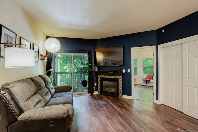 2430 W 82nd Pl Unit 2F, Westminster, CO 80031 - living area with wood finished floors, plenty of natural light, and a fireplace