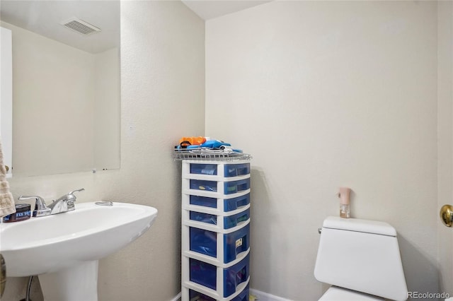 bathroom with sink and toilet