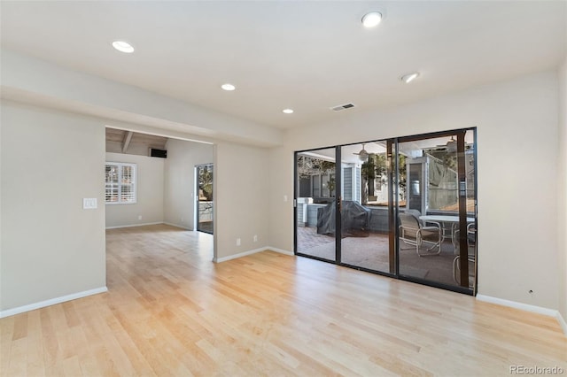 unfurnished room featuring recessed lighting, visible vents, baseboards, and wood finished floors