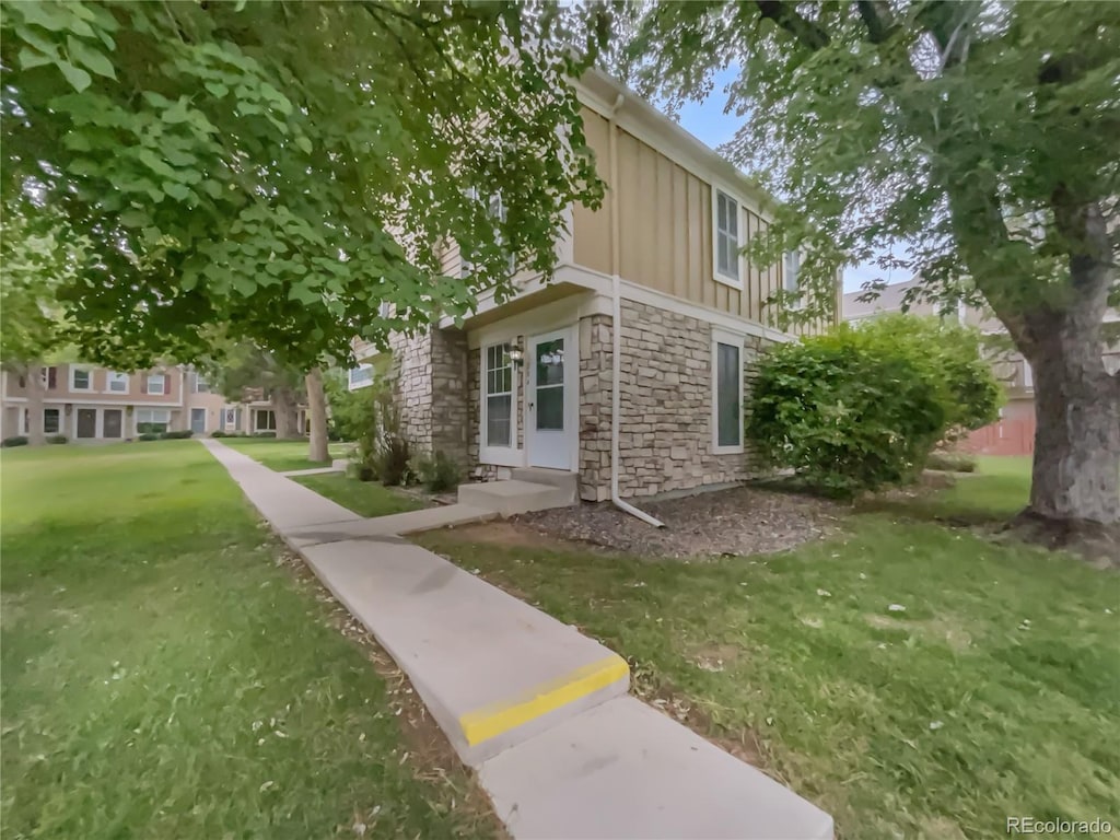 view of property exterior featuring a lawn