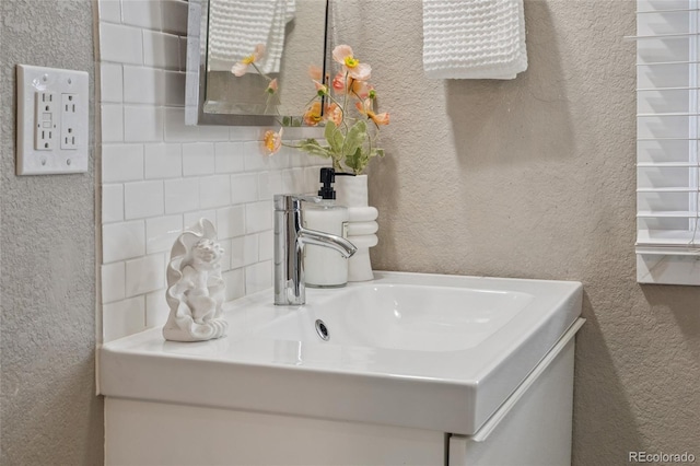 3881 Zenobia St, Denver, CO 80212 - bathroom featuring a textured wall and vanity