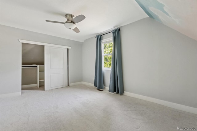 3881 Zenobia St, Denver, CO 80212 - unfurnished bedroom featuring carpet, vaulted ceiling, a closet, and a ceiling fan