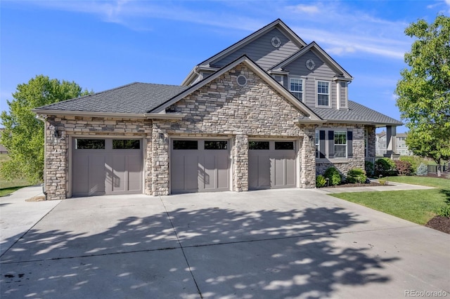 3041 Starling Ct, Castle Rock, CO 80109 - view of front of property with stone siding, concrete driveway, an attached garage, and a front yard