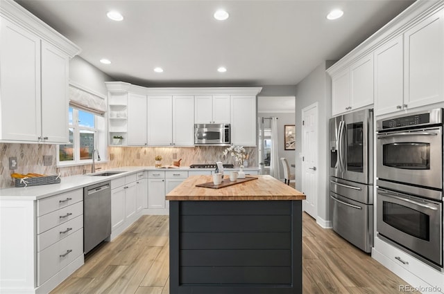3041 Starling Ct, Castle Rock, CO 80109 - kitchen featuring a sink, appliances with stainless steel finishes, butcher block counters, open shelves, and white cabinets