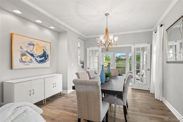 3041 Starling Ct, Castle Rock, CO 80109 - dining area featuring a chandelier, ornamental molding, baseboards, wood finished floors, and recessed lighting
