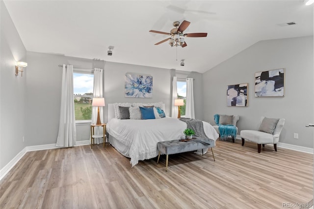 3041 Starling Ct, Castle Rock, CO 80109 - bedroom with light wood finished floors, multiple windows, baseboards, lofted ceiling, and a ceiling fan