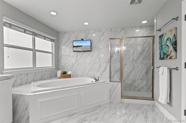 3041 Starling Ct, Castle Rock, CO 80109 - bathroom featuring a bath, marble finish floors, a shower stall, and recessed lighting