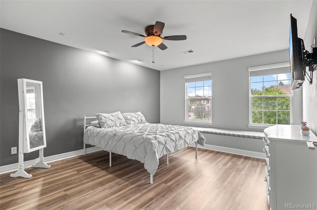 3041 Starling Ct, Castle Rock, CO 80109 - bedroom with light wood-type flooring, baseboards, and ceiling fan