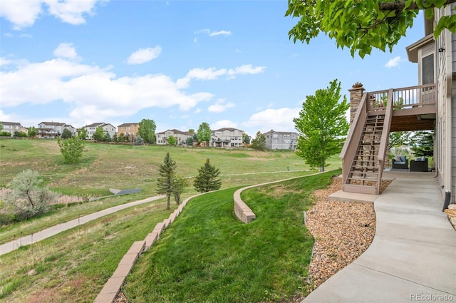3041 Starling Ct, Castle Rock, CO 80109 - view of green lawn with stairs, a residential view, and a wooden deck