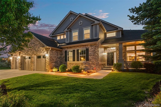 3041 Starling Ct, Castle Rock, CO 80109 - view of front facade featuring concrete driveway, stone siding, a yard, and an attached garage