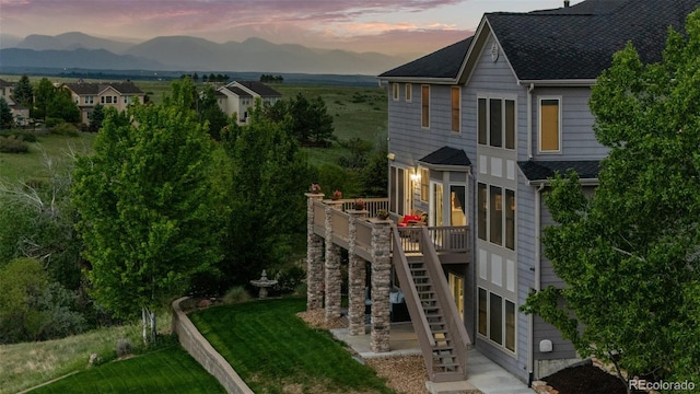 3041 Starling Ct, Castle Rock, CO 80109 - view of front of house featuring stairs, a deck with mountain view, and roof with shingles