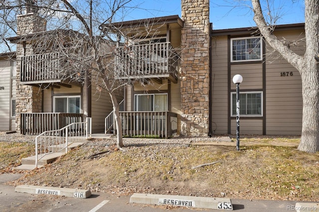 view of front of property with a balcony