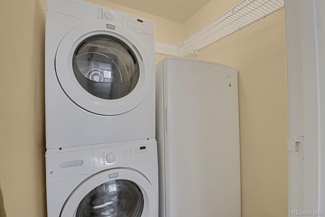 laundry area with stacked washer / dryer