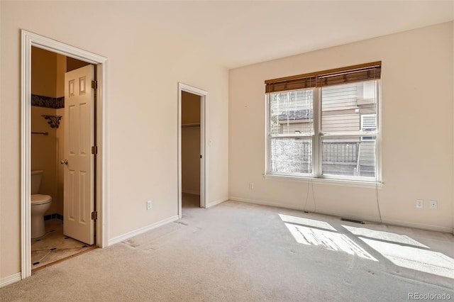 2561 Cactus Bluff Pl, Highlands Ranch, CO 80129 - unfurnished bedroom with carpet, a spacious closet, connected bathroom, and a closet