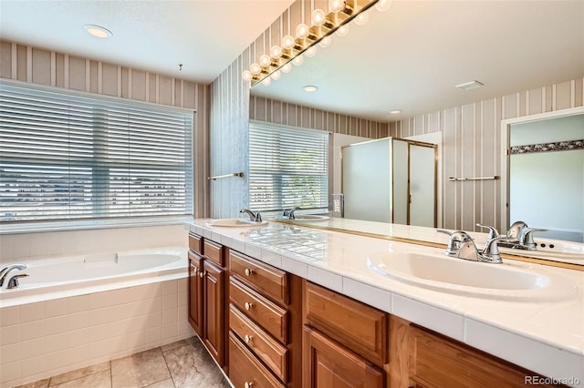2561 Cactus Bluff Pl, Highlands Ranch, CO 80129 - bathroom featuring a bath, double vanity, wallpapered walls, and a stall shower