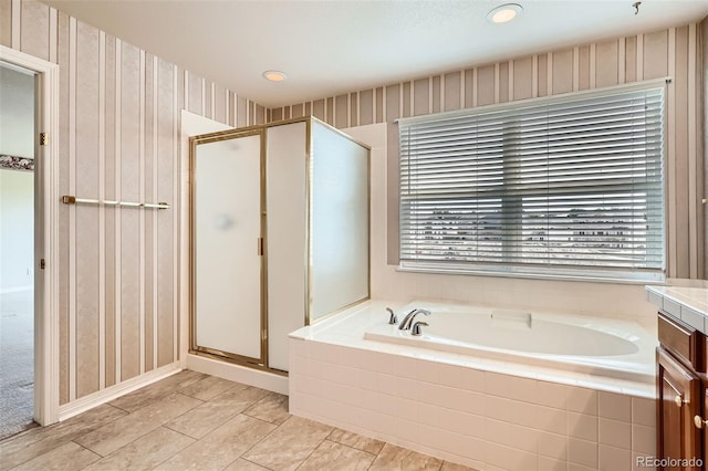 2561 Cactus Bluff Pl, Highlands Ranch, CO 80129 - bathroom featuring a garden tub, a shower stall, plenty of natural light, and vanity